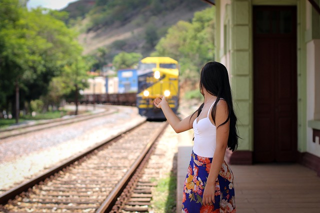 a girl waiting for a train