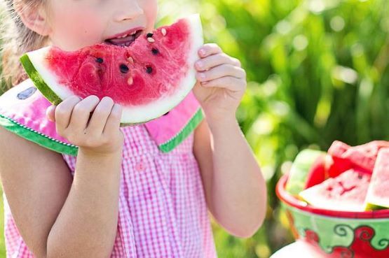 girl eating watermelon in the summer uk sturdy kids